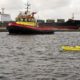 Pilot with sailing drone deployed for depth inspection of ships at locks
